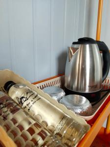 a tray with a tea pot and a tea kettle at Bake for You Camping in Ban Nong Bua