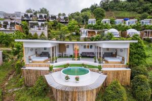 an aerial view of a house with a pool at Monsaan ม่อนซาน in Mon Jam