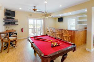 a living room with a pool table and a bar at SOSB26 South Beach Park #26-S in Salvo