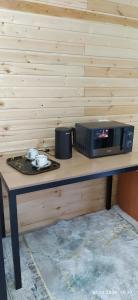 a microwave sitting on top of a table at Han Karakol in Karakol