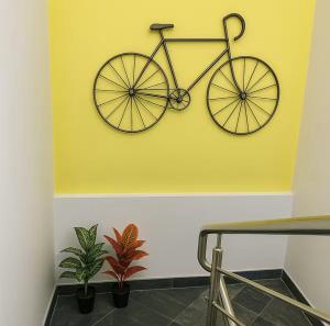 a bike hanging on a wall in a room at Irida 2bhk private pool viila in Assagao