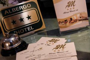 Sertifikat, nagrada, logo ili drugi dokument prikazan u objektu Albergo Munsci'