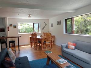 a living room with a couch and a table at Rata Lodge Accommodation in Otira
