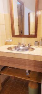 a bathroom with a sink and a mirror at Barreal La Templanza Casa de Campo in Barreal +42 photos
