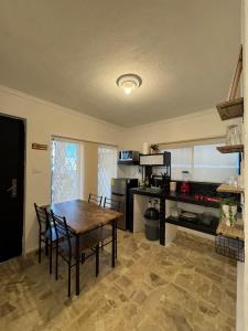 a kitchen and dining room with a table and chairs at Equipped apartment in industrial area in Ciudad Satelite del Norte