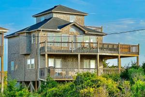 a large brick house with a large deck at FO13 Dreamcatcher in Frisco