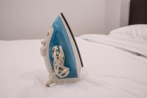 a computer monitor sitting on top of a bed at Newly Renovated 2BR Basement Suite, Private Entry in Pickering