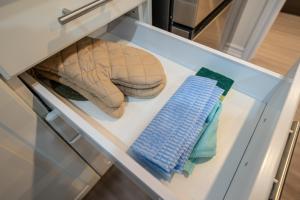 a drawer with two stuffed animals and towels in it at Newly Renovated 2BR Basement Suite, Private Entry in Pickering +24 photos