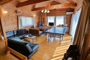 a living room with a ping pong table at ve-nasu本館 in Nasu