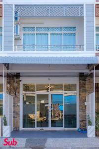 a building with a balcony on top of it at Dream Home in Hat Yai in Ban Kohong