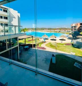 a view of a swimming pool from a building at Bluu lagoons in Los Cerritos