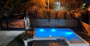 a swimming pool in a backyard at night at V&V House in Concordia