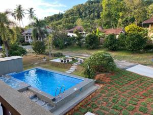 an overhead view of a swimming pool in a yard at theorenda 002 in Koh Samui