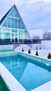 a large swimming pool in front of a building at AkbA-Frame4 in İsmayıllı