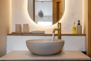 a bowl sink with a faucet in a bathroom at Somers Loft in Zuid-Beijerland +29 photos