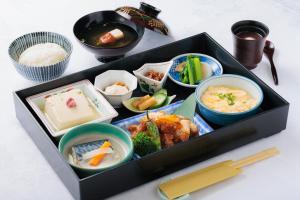 a tray filled with different types of food on a table at Tokyo Asakusabashi Belmont Hotel in Tokyo