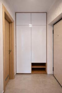 a room with a large sliding glass door at Muki Oaza Apartman in Tuzla +1 photo