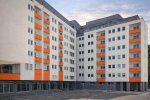 an image of two apartment buildings at Hari Apartmani Oaza in Tuzla