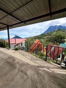 a view of the mountains from a building at Kanso Hill Guesthouse in Ranau