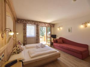 Postel nebo postele na pokoji v ubytování Hotel Vajolet