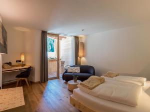 Postel nebo postele na pokoji v ubytování Hotel Vajolet
