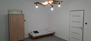 a bedroom with a bed and a horse on the ceiling at U Piškota in Desná +2 photos