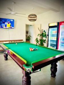 a snooker table in a room with a pool table at MountBaylk in Mount Lavinia