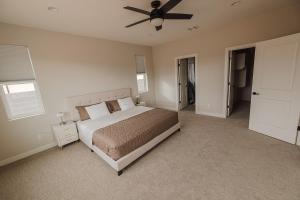 a bedroom with a bed and a ceiling fan at The Mustang Collection 55 in Page