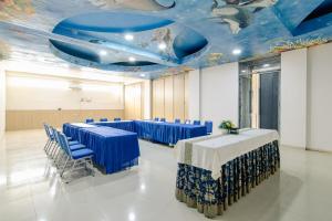 a room with blue tables and chairs and a blue ceiling at Azana BeSt Hotel Batu in Tlekung +71 photos