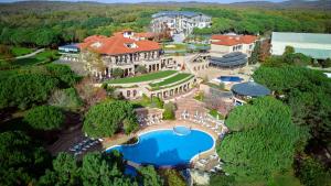 an aerial view of a mansion with a swimming pool at Kemer Country Hotel İstanbul in Istanbul