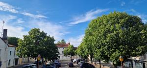 a street with cars parked on the side of the road at Le Peekskill in Montbron