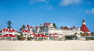 a large building with red roofs on a beach at Convention close by 2BR Suite Free Parking in San Diego