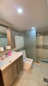 a bathroom with a sink and a toilet at Wadi Rum Faris in Wadi Rum +67 photos