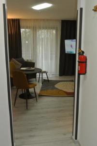 a living room with a couch and a table at Kemnater Hof Apartments SELF-CHECK-IN in Ostfildern
