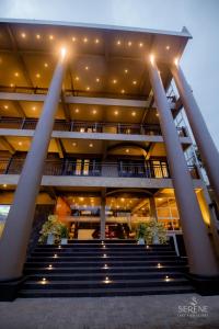 a view of a building with stairs and lights at Serene Lake View Resort in Anuradhapura
