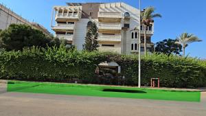 a building with a green lawn in front of it at Luxury Appartement in Trâblous