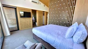 a bedroom with a large bed in a room at Guide Hill Station Lodge in Lake Tekapo