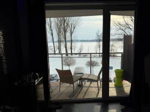 a view of a balcony with a view of the water at SECRET LOVE studio in Ełk