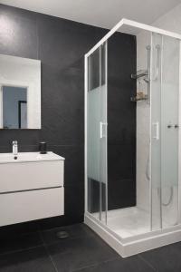 a bathroom with a shower and a sink at Zena Park - Near Lisbon in Odivelas
