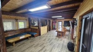a room with a bed and a table in a cabin at Cămăruța din Apuseni in Valea Ierii
