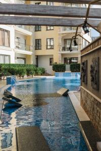 a large swimming pool in the middle of a building at The Dream Getaway & Spa by DeVasco in Bečići