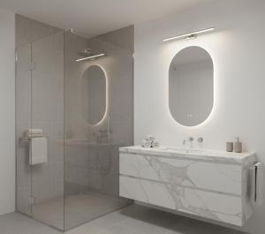 a bathroom with a sink and a glass shower at hayal hotel in Tokat