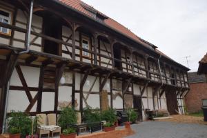 an old wooden building with a bench in front of it at Wippertaler Hütte in Kleinfurra