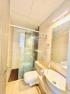 a bathroom with a toilet and a sink at 3 bedroom Shreeji's Viila with Private pool in Lonavala +25 photos