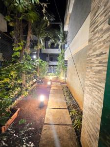 a garden with lights on the side of a building at 3 bedroom Shreeji's Viila with Private pool in Lonavala