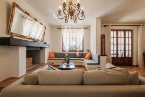 a living room with a couch and a fireplace at Domo de Iannas-House Live Express in Quartu Sant'Elena