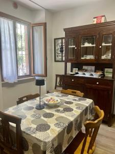 a dining room table with a table cloth on it at B&B Al Vecchio Mulino in Celano