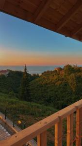 a view of the ocean from the porch of a house at Willa's Trebisonda Bungalov in Arsin +3 photos