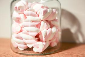 a glass jar filled with pink marshmallows at Cà Bèla - Venini in Milan