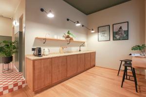 a kitchen with a counter in a room at Cà Bèla - Venini in Milan +66 photos